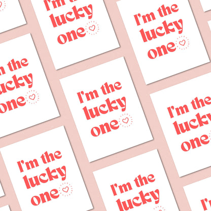 Greeting card with bold red letters and the phrase "I'm The Lucky One" with a small heart, perfect for anniversaries, Valentine's Day, or expressing love and appreciation.