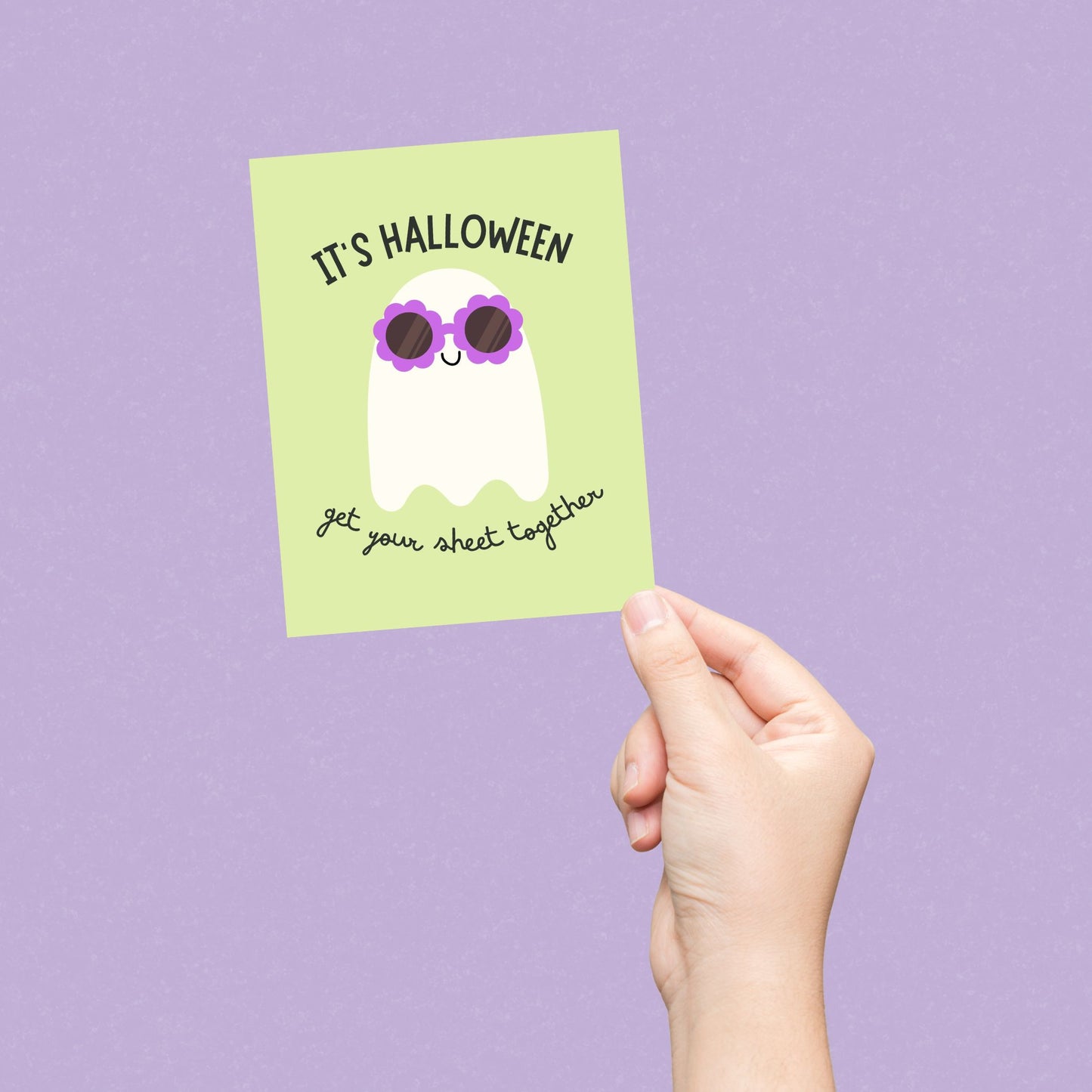 Cute Halloween greeting card featuring a ghost wearing flower-shaped sunglasses with the phrase It's Halloween, Get Your Sheet Together, funny spooky design perfect for sending Halloween laughs.