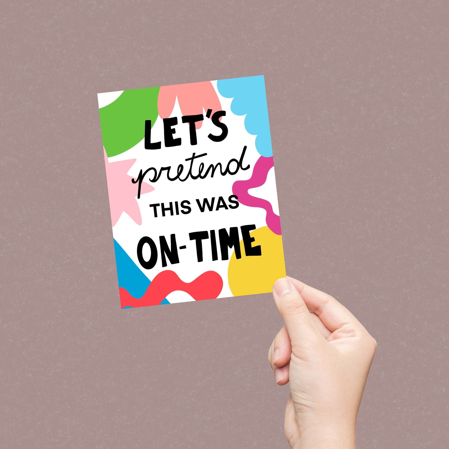 Colorful geometric background greeting card with the phrase Let's Pretend This Was On-time written in black. Perfect for belated birthday wishes or any late celebration. Funny and vibrant design.