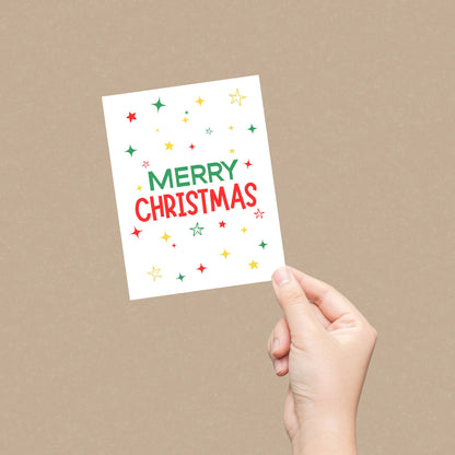 Festive Christmas greeting card with the words Merry Christmas surrounded by green, red, and yellow stars, perfect for holiday cheer and seasonal wishes, vibrant and colorful holiday stationery.