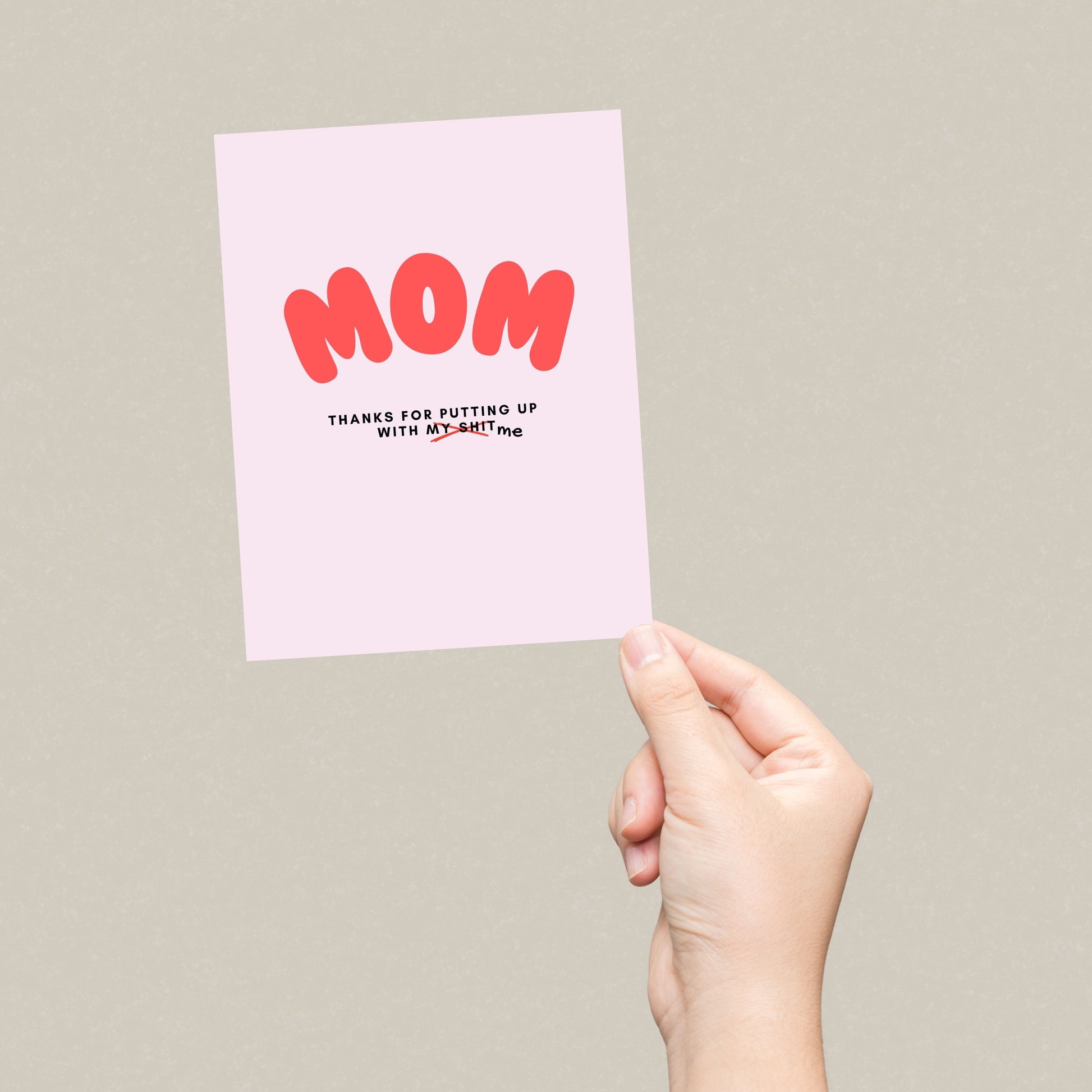 Bold and funny greeting card for mom with MOM in big red letters and the phrase Thanks for putting up with my shit, perfect for Mother's Day, birthday, or everyday appreciation. Ideal for showing gratitude with a humorous twist.