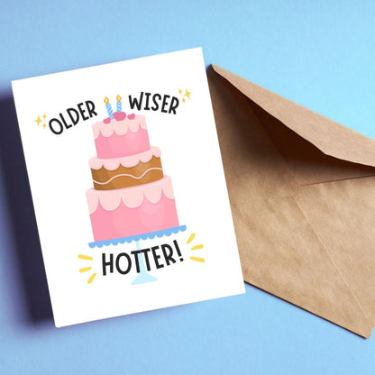 Funny birthday card with a pink three-layer cake and the phrase “Older Wiser Hotter.” Perfect for women, friends, or sisters who love cute, humorous birthday cards with a confident and sassy design.