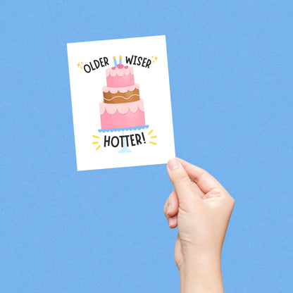Funny birthday card with a pink three-layer cake and the phrase “Older Wiser Hotter.” Perfect for women, friends, or sisters who love cute, humorous birthday cards with a confident and sassy design.