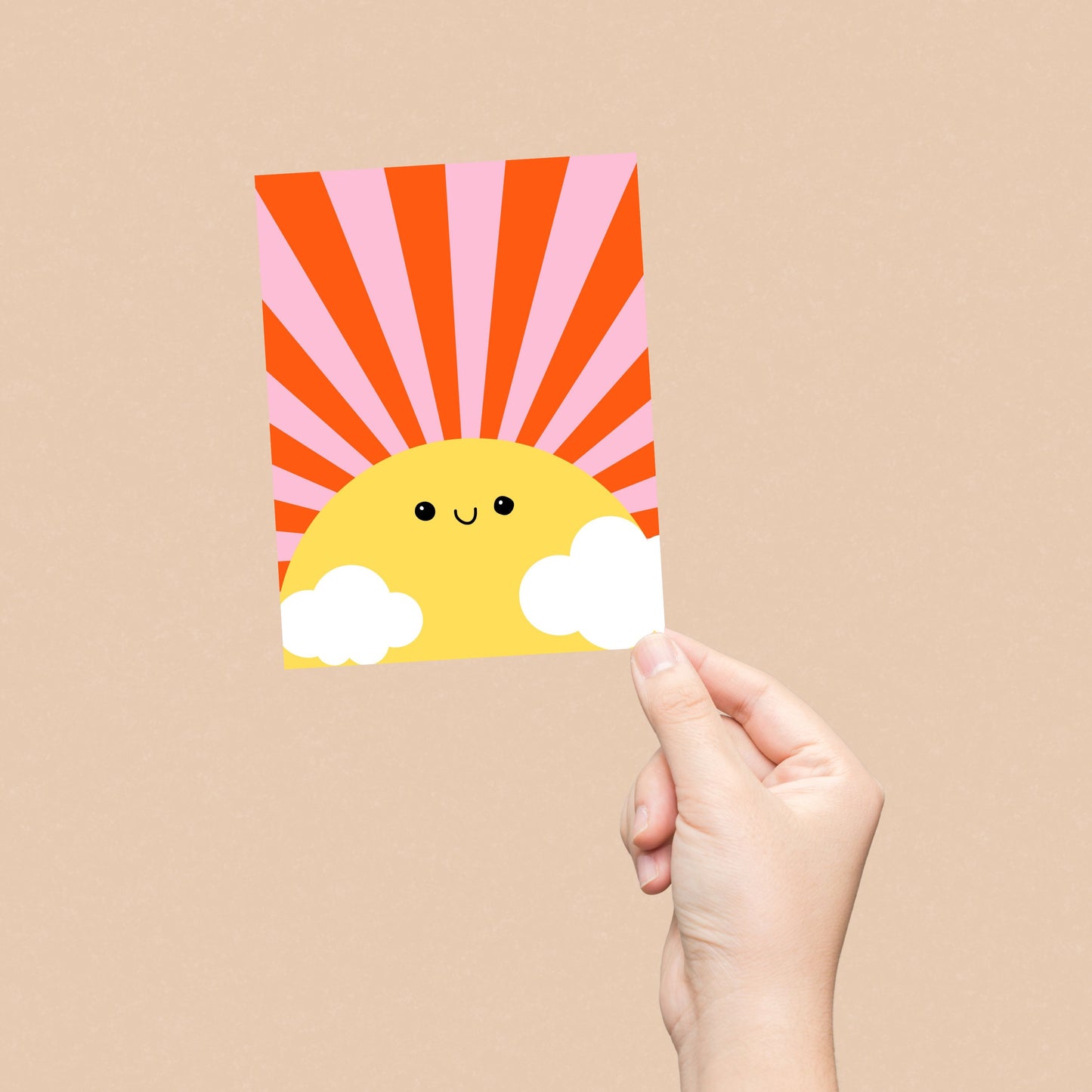 Sunshine Greeting Card with a drawing of a big yellow sun with a smiling face, pink and red rays, and two clouds. Blank inside, perfect for spreading cheerful vibes and warm wishes.