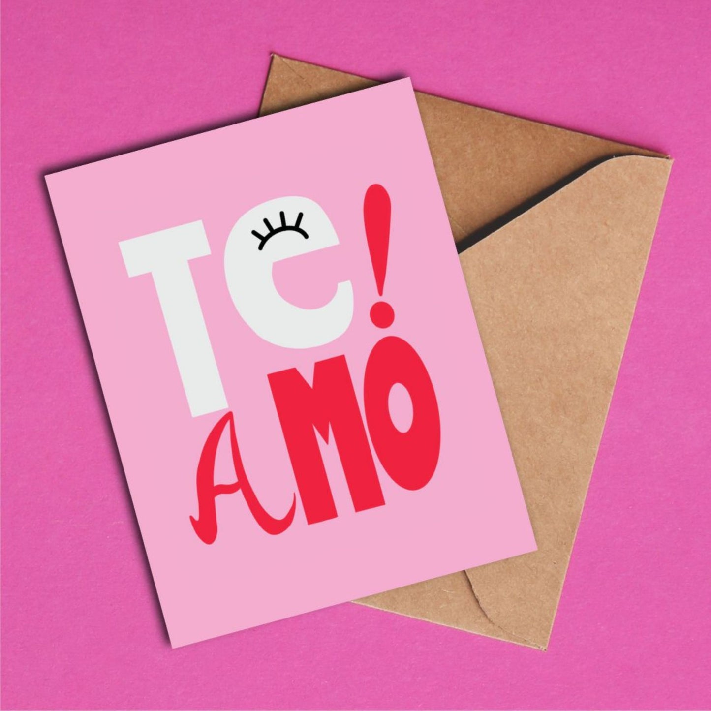 Te Amo greeting card with pink background, perfect for expressing love and affection, playful and whimsical design, ideal for anniversaries, special occasions, or just because, heartfelt and fun way to say "I love you" in Spanish and Portuguese.