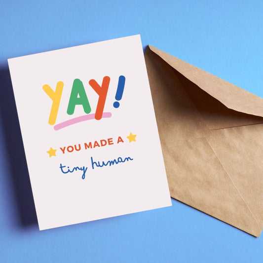 Yay You Made A Tiny Human greeting card with colorful letters and two stars, perfect for congratulating new parents.