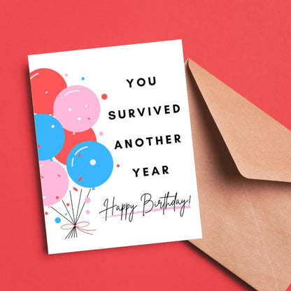 Funny birthday card with colorful balloons and the phrase "You Survived Another Year. Happy Birthday!" Celebrate another year with this playful and relatable greeting card.