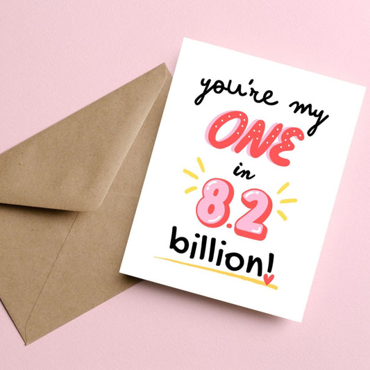 Greeting card with the phrase "You're my one in 8.2 billion" in cute, playful fonts, perfect for Valentine's Day, anniversaries, or romantic occasions. Unique love card for couples, celebrating your one-of-a-kind partner with humor and charm.