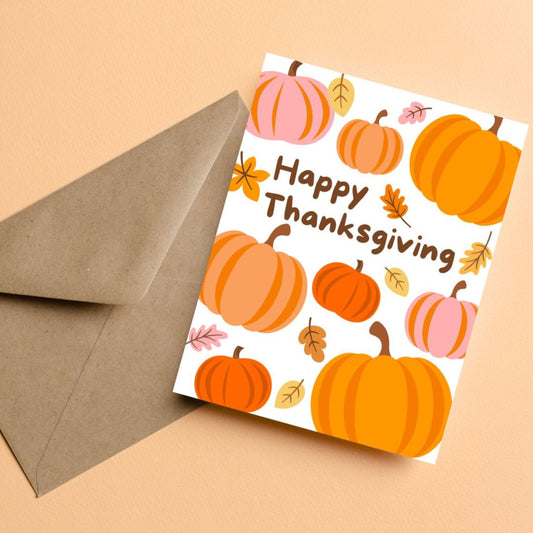 Thanksgiving greeting card with pumpkins and autumn leaves, featuring the phrase 'Happy Thanksgiving'. Festive fall-themed card perfect for expressing gratitude and sending holiday cheer.