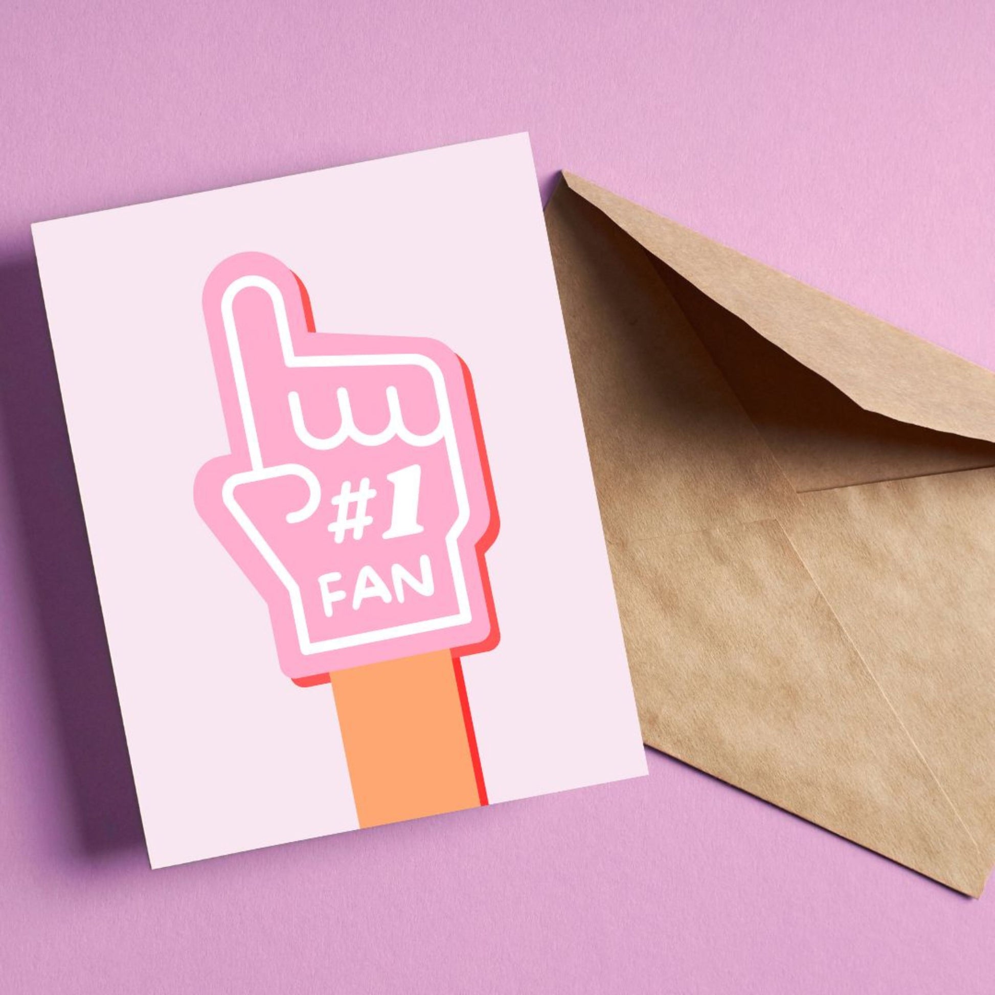 Greeting card with the phrase Number 1 Fan featuring a drawing of a pink foam hand with #1 Fan on it. Perfect for showing support and celebrating someone's awesomeness with cuteness and enthusiasm.