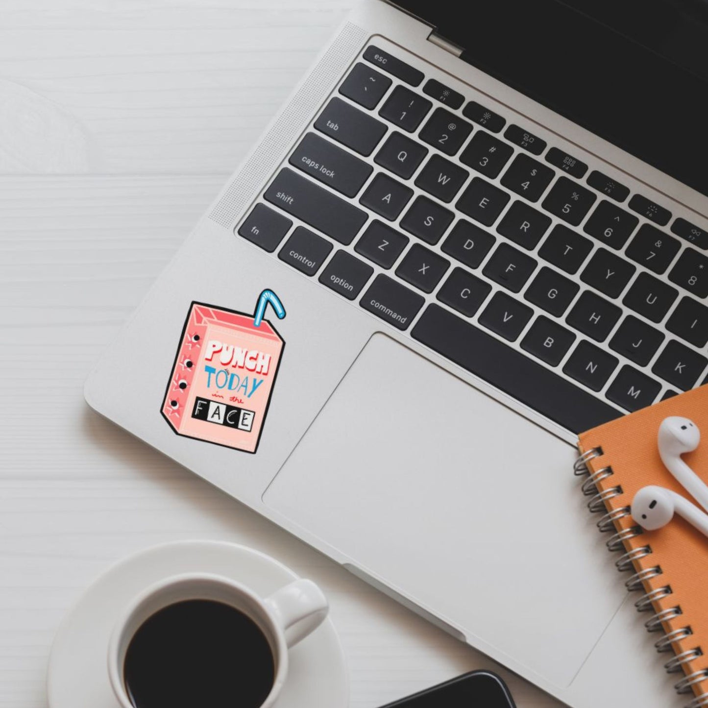 Punch Today In The Face sticker with an original drawing of a juice box and the motivational phrase written on it. Perfect for laptops, water bottles, and planners, this durable vinyl sticker combines humor and determination in a quirky design.