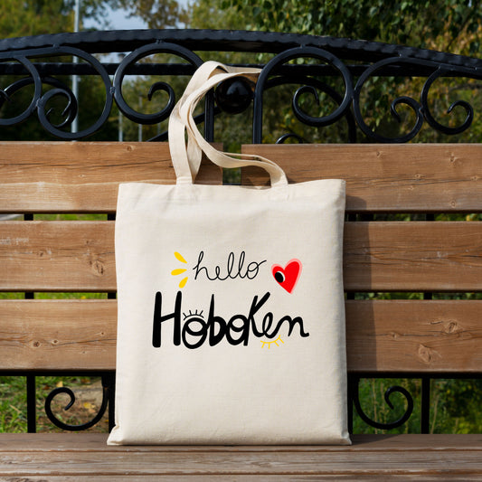 Tote bag with red heart and big eye design, called Hello Hoboken, representing Hoboken, New Jersey, perfect for stylish everyday use.