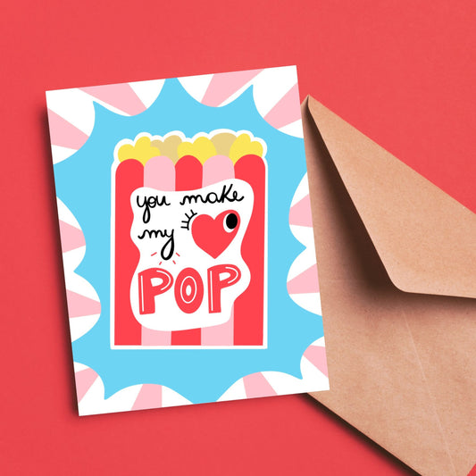 Quirky greeting card featuring an old-style popcorn bag with the phrase You Make My Heart Pop, where heart is replaced by a red heart with one eye. Perfect for Valentine's Day, anniversaries, or special occasions, this card adds a fun twist to love.