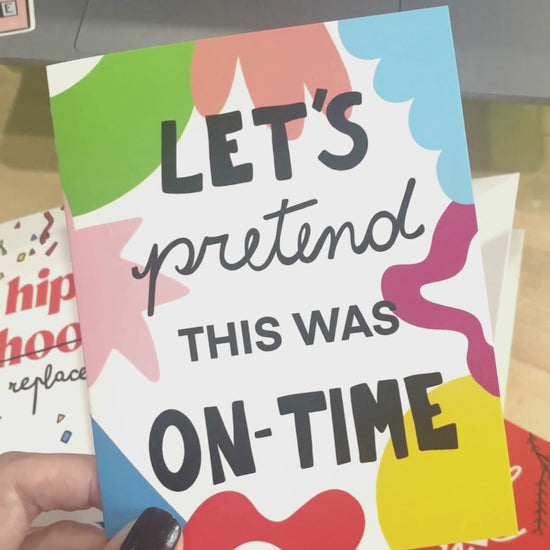 Colorful geometric background greeting card with the phrase Let's Pretend This Was On-time written in black. Perfect for belated birthday wishes or any late celebration. Funny and vibrant design.