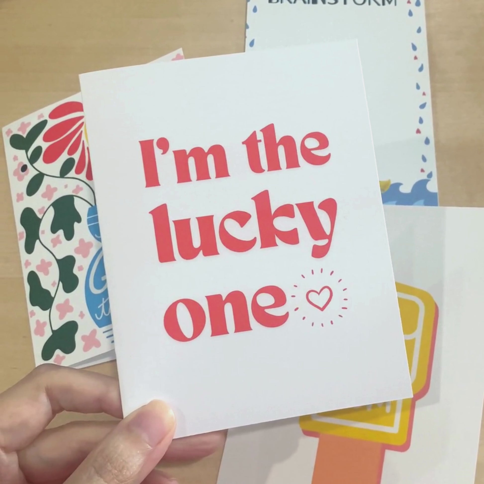 Greeting card with bold red letters and the phrase "I'm The Lucky One" with a small heart, perfect for anniversaries, Valentine's Day, or expressing love and appreciation.