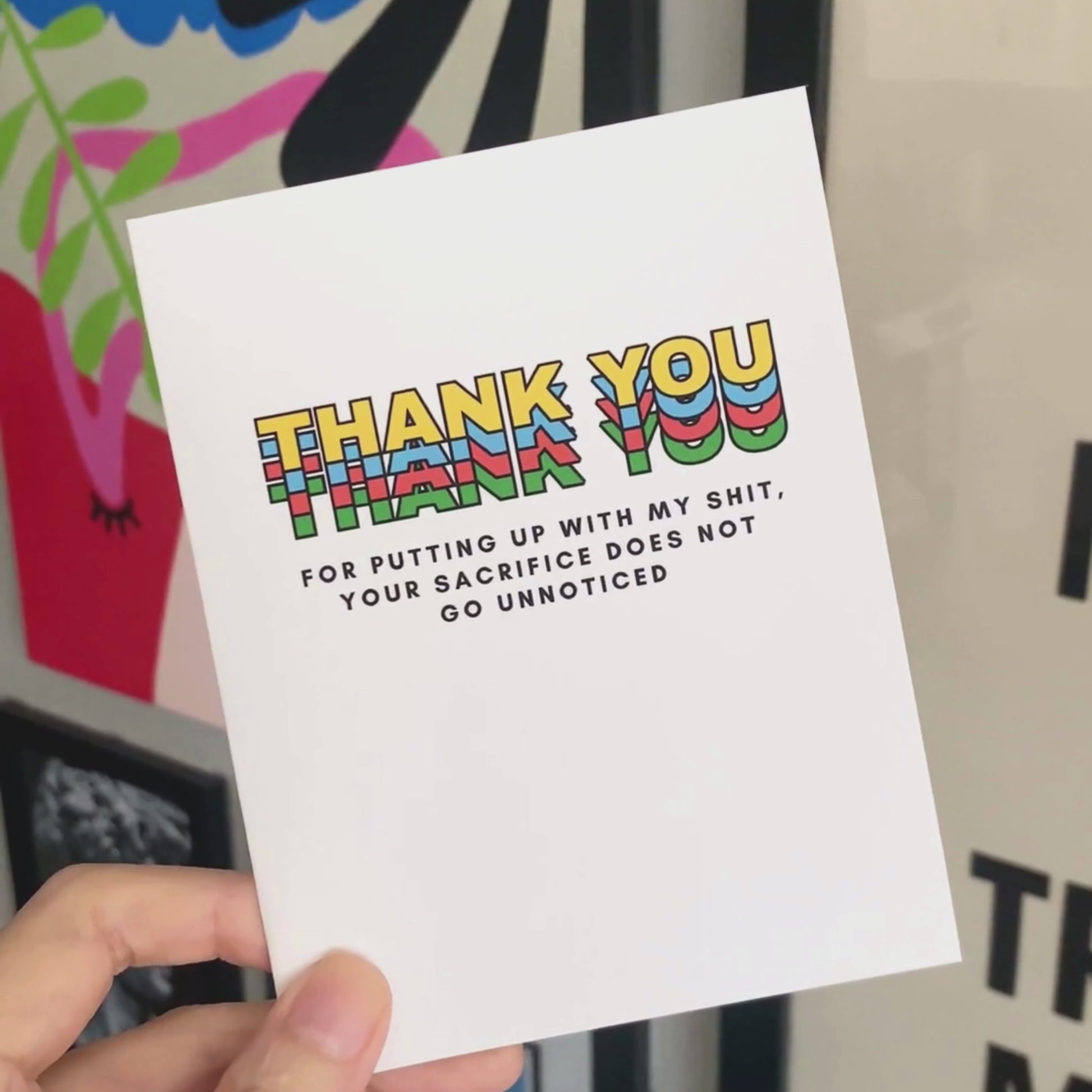 Greeting card with colorful block letters spelling Thank You and smaller text reading for putting up with my shit your sacrifice does not go unnoticed. Perfect for expressing gratitude with humor and a personal touch.